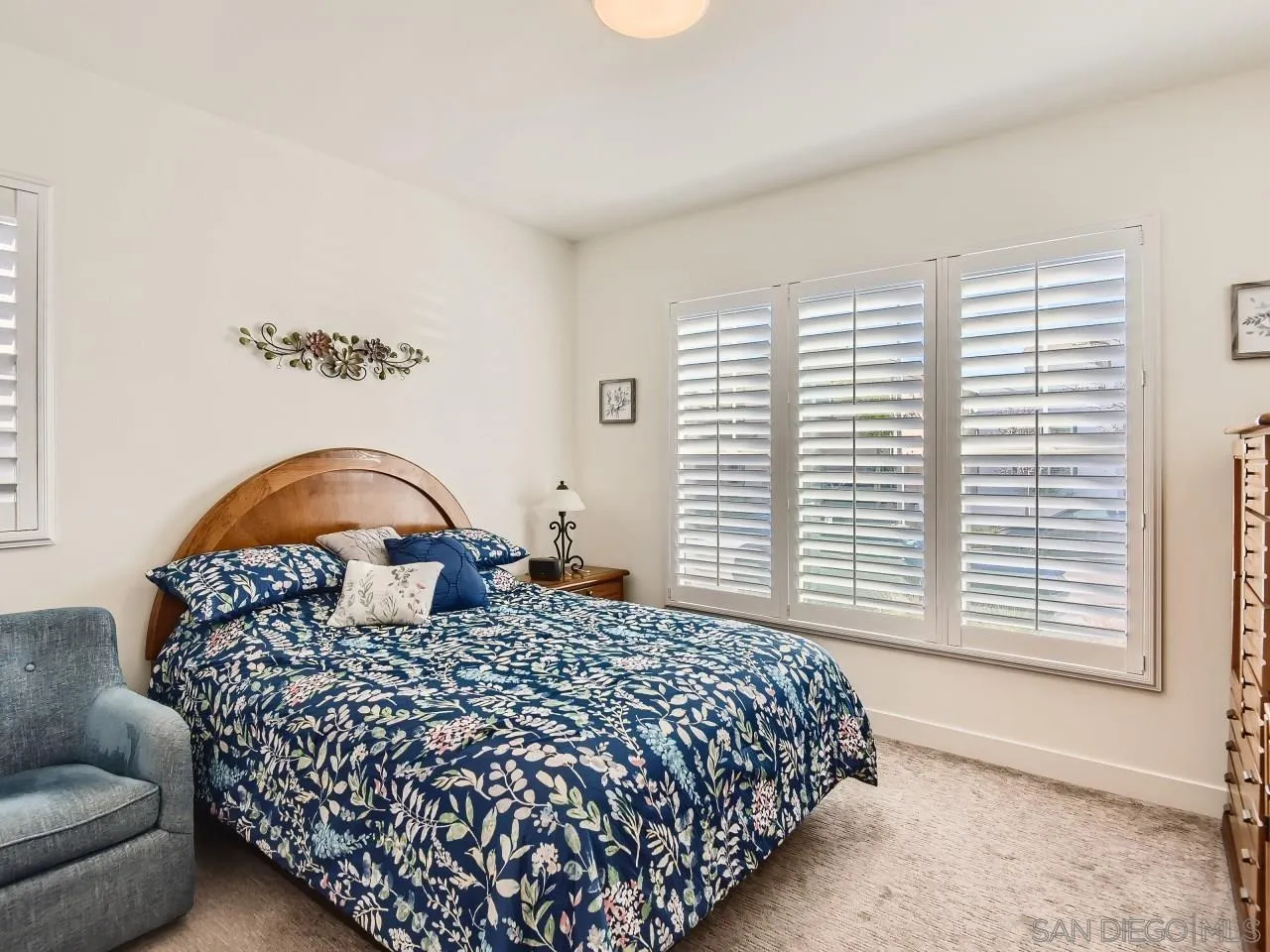 9069 West Bluff Place Santee, CA 92071 - Photo 23 of 45 a bedroom with a large bed couch and a window