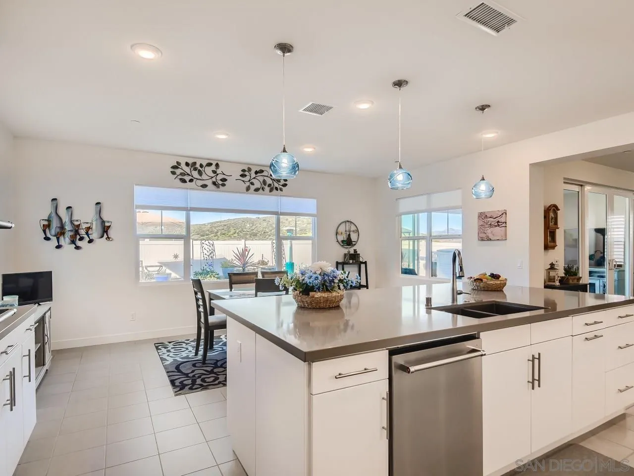 9069 West Bluff Place Santee, CA 92071 - Photo 8 of 45 a kitchen with a sink and cabinets