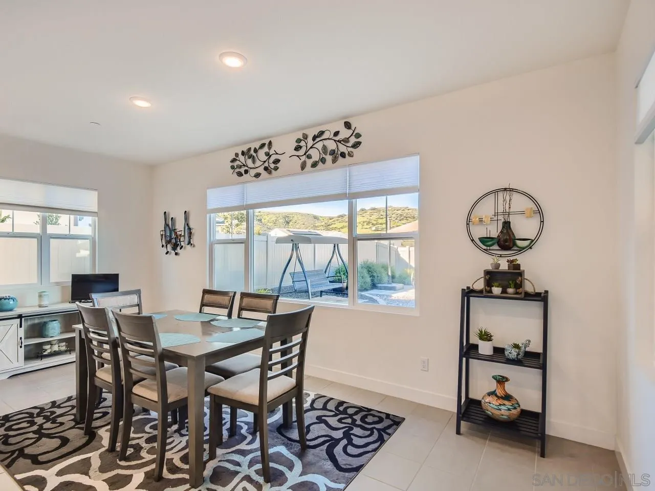 9069 West Bluff Place Santee, CA 92071 - Photo 10 of 45 a view of a dining room with furniture window and outside view