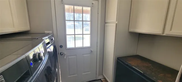 a view of a storage and utility room in a kitchen
