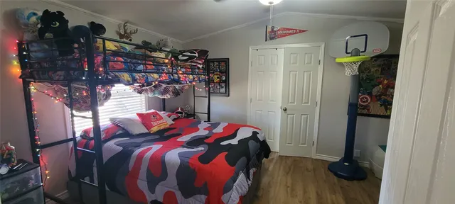 a bedroom with a bed and a walk in closet