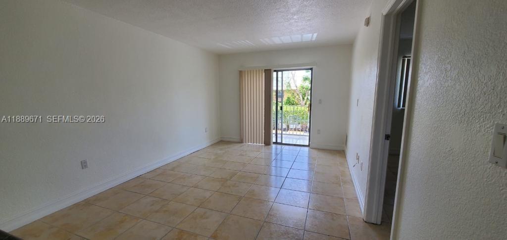445 Southwest 11th Street, Unit 203 Miami, FL 33130 - Photo 11 of 18 a view of an empty room and window