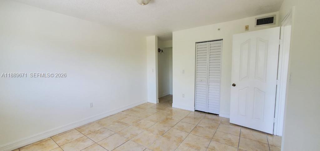 445 Southwest 11th Street, Unit 203 Miami, FL 33130 - Photo 5 of 18 a view of an empty room