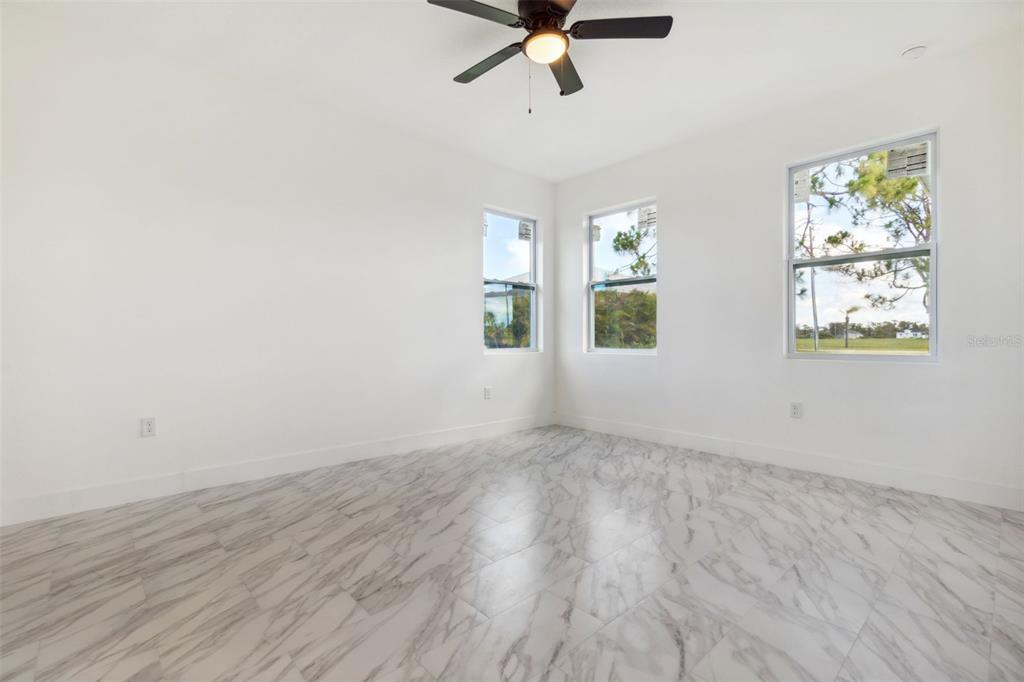8 Cleat Court Placida, FL 33946 - Photo 12 of 24 wooden floor in an empty room with a window