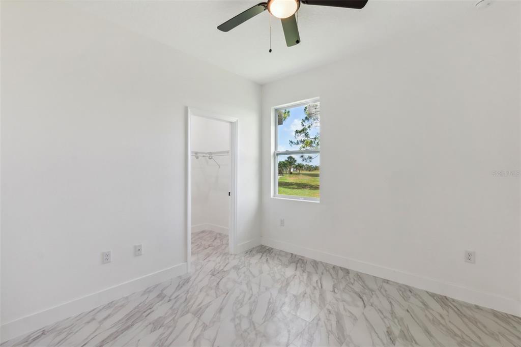 8 Cleat Court Placida, FL 33946 - Photo 18 of 24 an empty room with window and ceiling fan