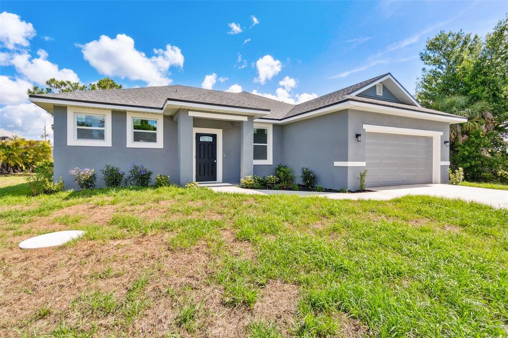 8 Cleat Court Placida, FL 33946 - Photo 4 of 24 a view of a house with yard and a garden
