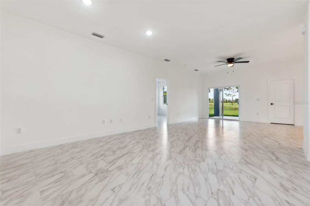 8 Cleat Court Placida, FL 33946 - Photo 6 of 24 a view of an empty room with window and wooden floor