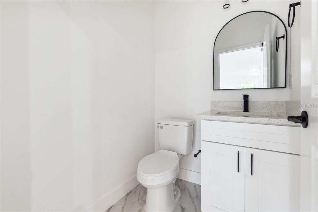 8 Cleat Court Placida, FL 33946 - Photo 9 of 24 a bathroom with a toilet sink and mirror