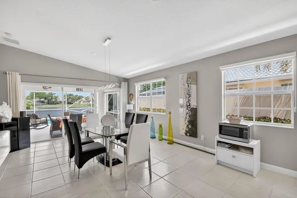 a bathroom with a double vanity sink toilet mirror and shower