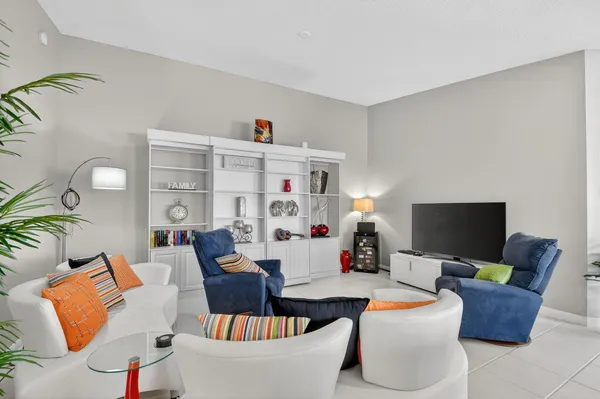a bathroom with a granite countertop sink toilet mirror and bathtub