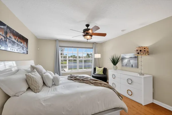 a dining room with furniture a rug and a chandelier