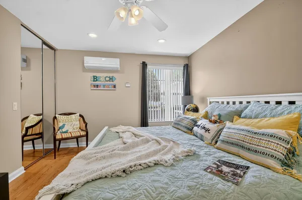 an aerial view of residential houses with outdoor space and swimming pool