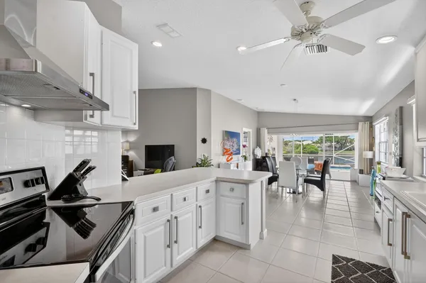 a work room with furniture and a large window