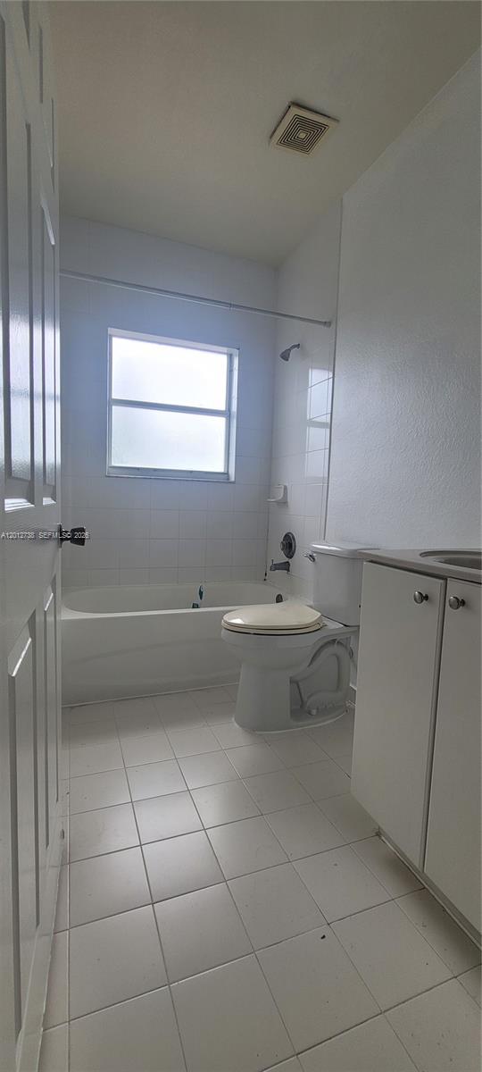 33 East 20th Street, Unit 206 Hialeah, FL 33010 - Photo 13 of 15 a bathroom with a sink a toilet and mirror