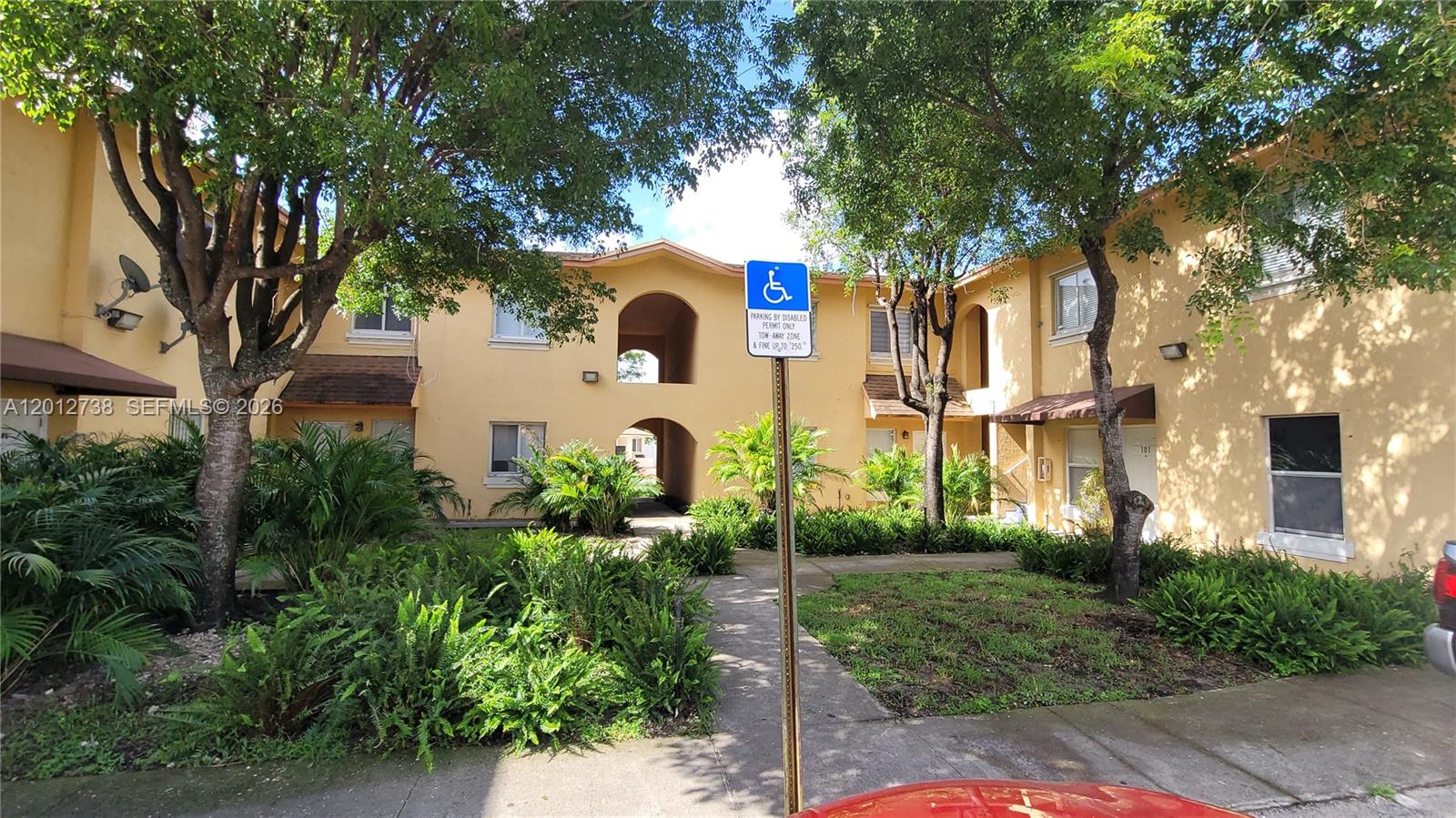 33 East 20th Street, Unit 206 Hialeah, FL 33010 - Photo 15 of 15 a front view of a house with garden