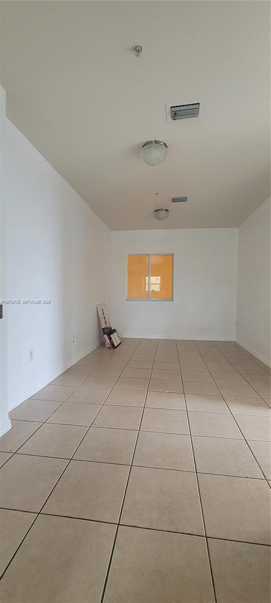 33 East 20th Street, Unit 206 Hialeah, FL 33010 - Photo 5 of 15 a view of an empty room and a window