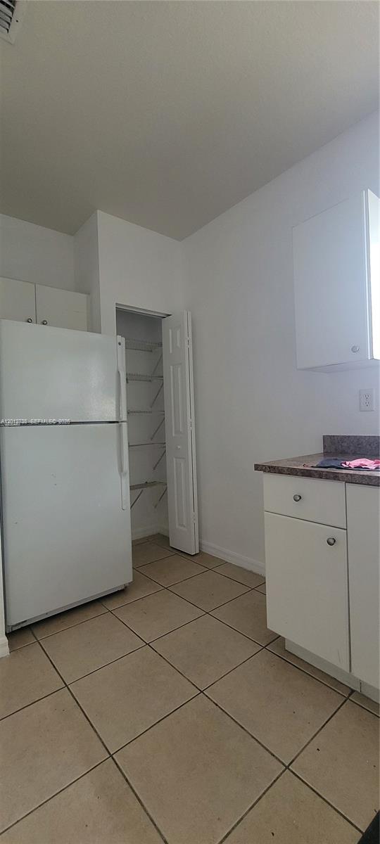 33 East 20th Street, Unit 206 Hialeah, FL 33010 - Photo 7 of 15 a kitchen with cabinets and white appliances