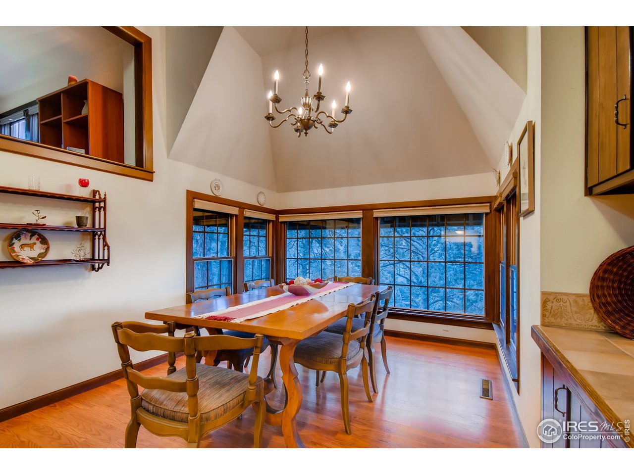 6325 Red Hill Road Boulder, CO 80302 - Photo 13 of 40 a view of a dining room with furniture and chandelier