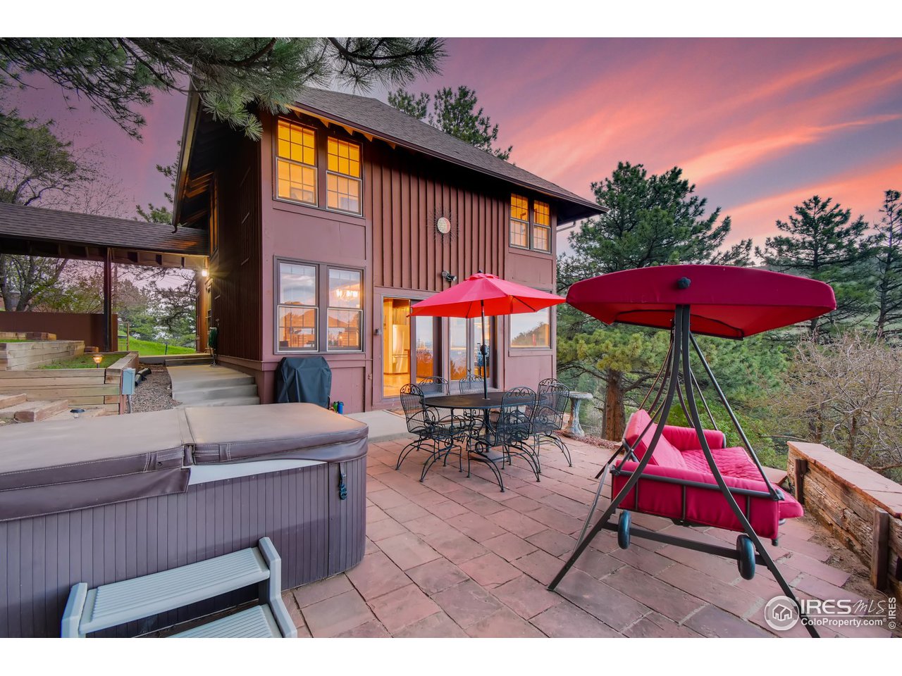 6325 Red Hill Road Boulder, CO 80302 - Photo 2 of 40 a sitting area with furniture and umbrella