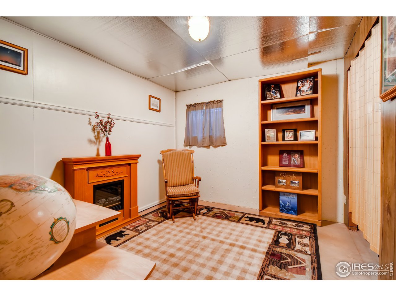 6325 Red Hill Road Boulder, CO 80302 - Photo 26 of 40 a room with furniture and a fireplace