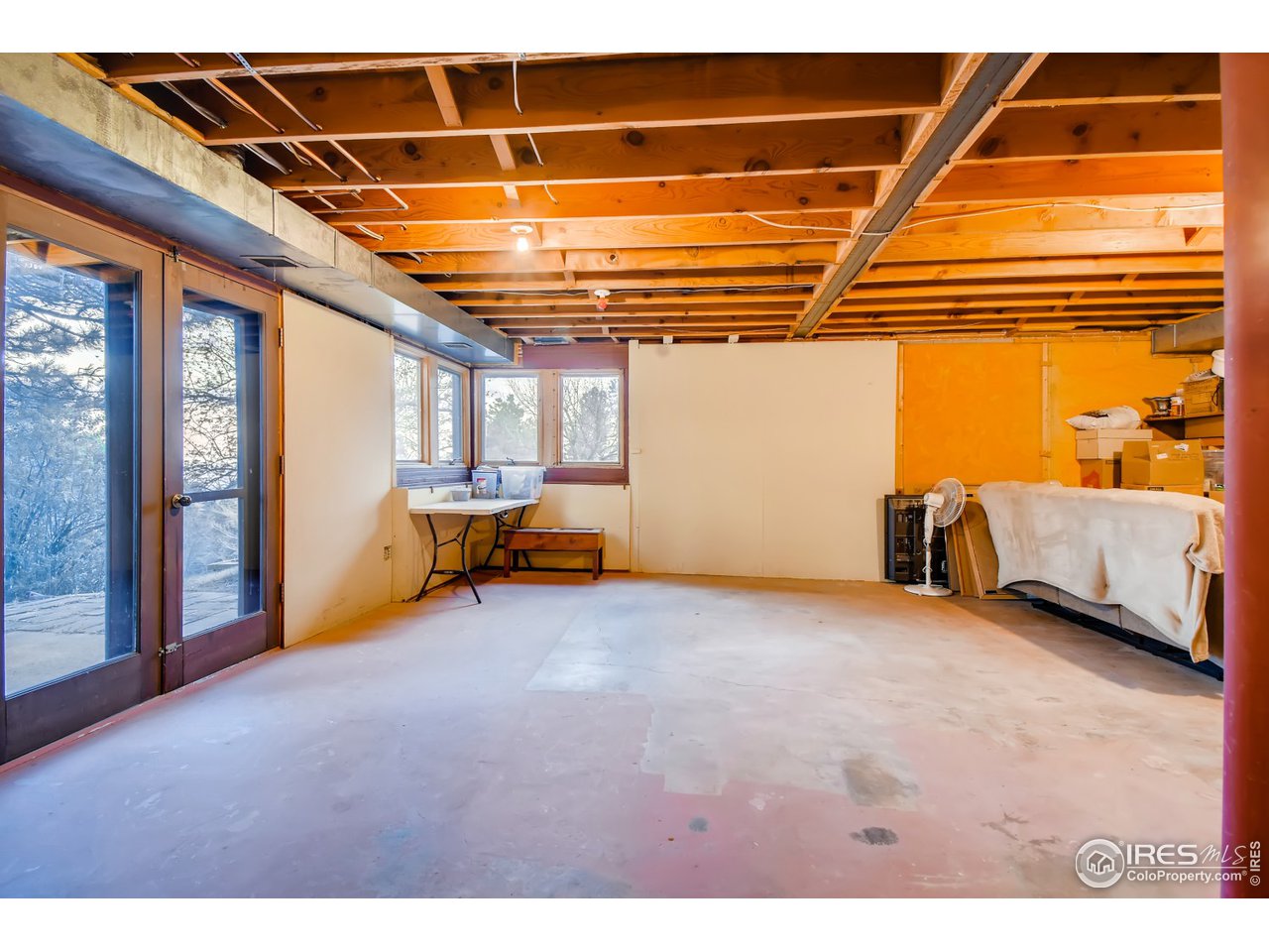 6325 Red Hill Road Boulder, CO 80302 - Photo 27 of 40 a view of a room with gym equipment and a large window