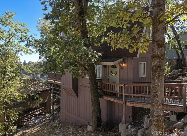 a view of a house with a tree