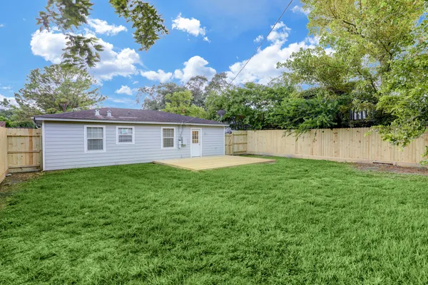 a backyard of a house with lots of green space
