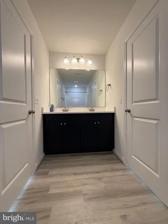a bathroom with a sink and mirror