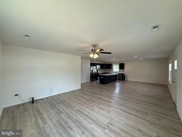 a view of a livingroom with furniture and wooden floor