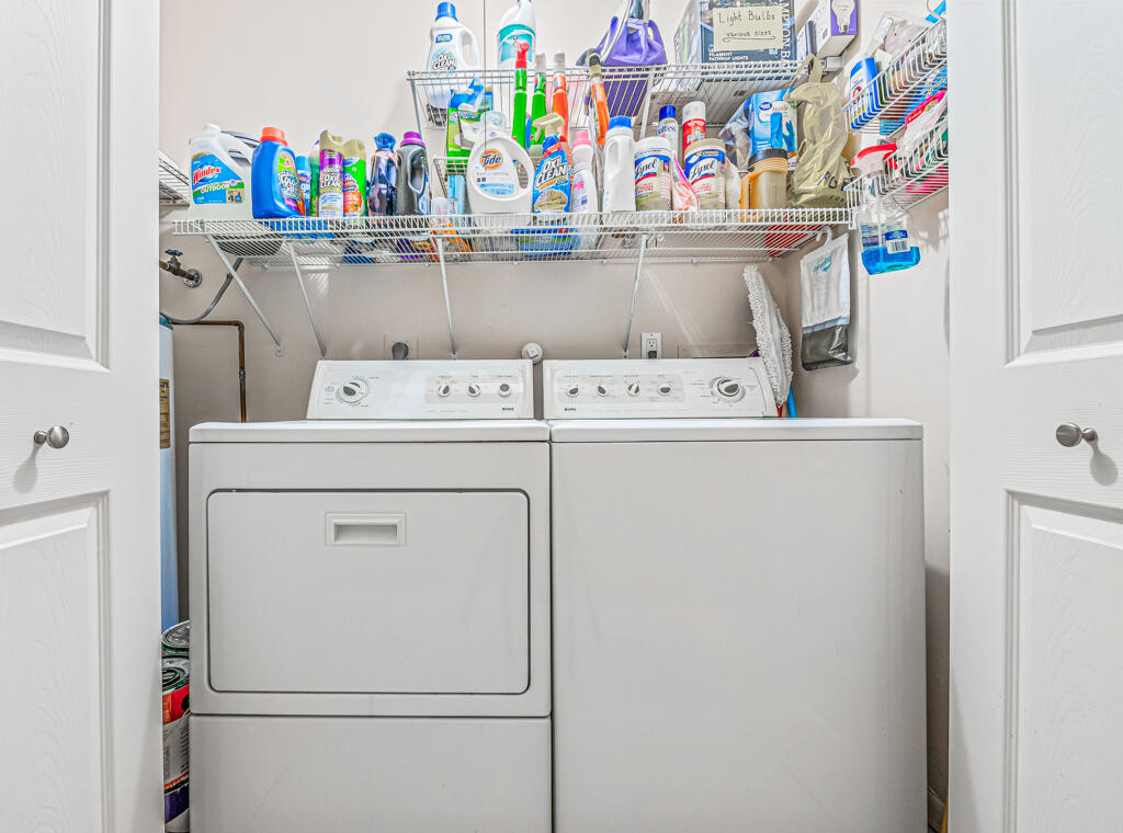 5121 Nesting Way, Unit D Delray Beach, FL 33484 - Photo 31 of 34 a utility room with dryer and washer