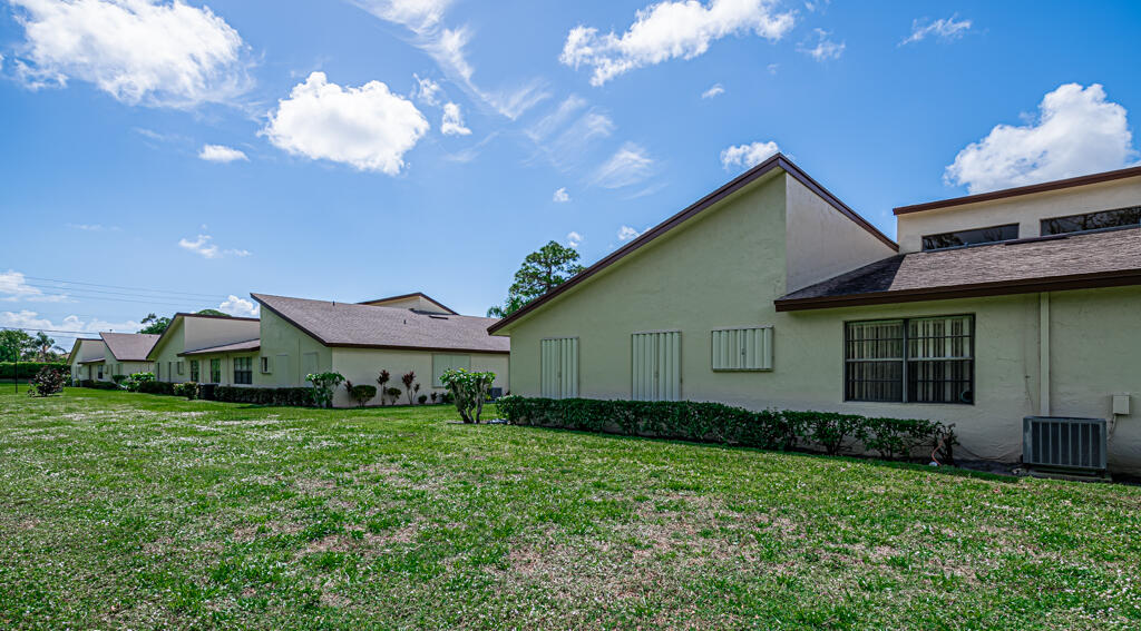 5121 Nesting Way, Unit D Delray Beach, FL 33484 - Photo 34 of 34 a view of a house with garden