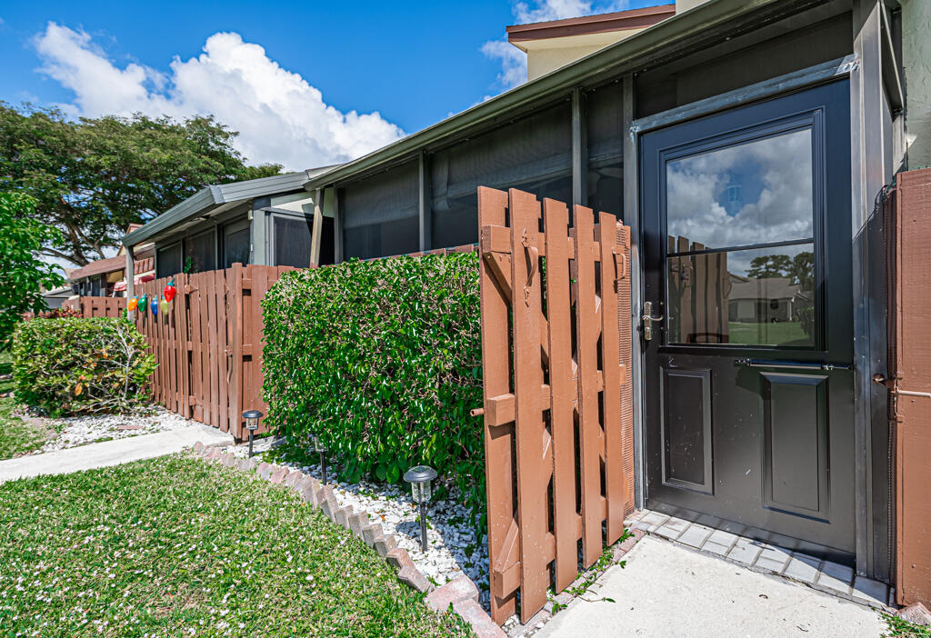 5121 Nesting Way, Unit D Delray Beach, FL 33484 - Photo 5 of 34 a view of a house with a door