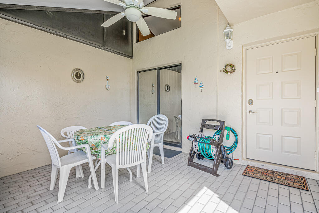 5121 Nesting Way, Unit D Delray Beach, FL 33484 - Photo 6 of 34 a view of a dining room with furniture and a window