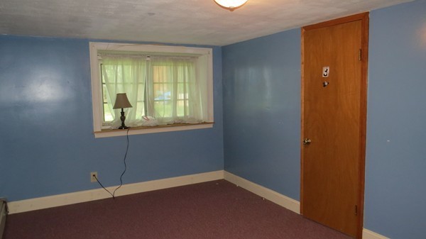 8 Manomet Road Woburn, MA 01801 - Photo 11 of 16 an empty room with windows