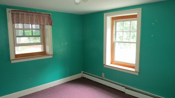 8 Manomet Road Woburn, MA 01801 - Photo 13 of 16 a room with a window and a lamp