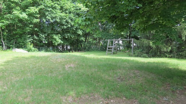 8 Manomet Road Woburn, MA 01801 - Photo 15 of 16 a view of a park with large trees