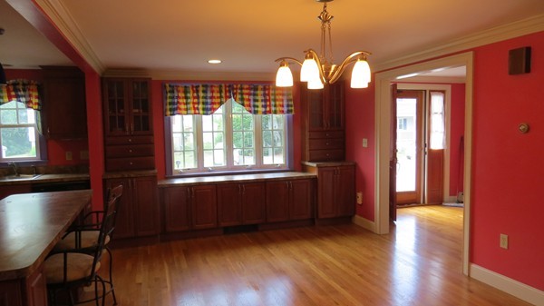 8 Manomet Road Woburn, MA 01801 - Photo 5 of 16 a view of a room with wooden floor and windows
