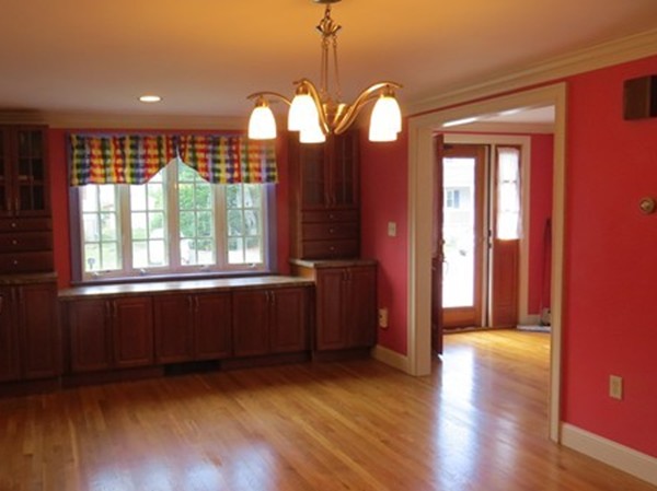 8 Manomet Road Woburn, MA 01801 - Photo 6 of 16 a view of empty room with wooden floor and fan