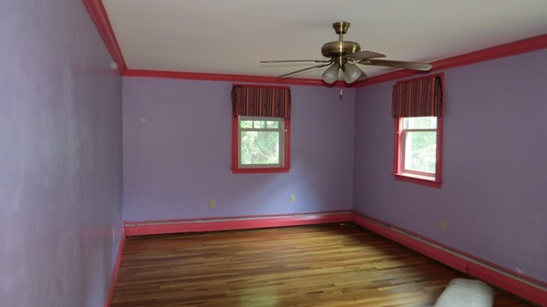 8 Manomet Road Woburn, MA 01801 - Photo 8 of 16 a view of room with window and ceiling fan