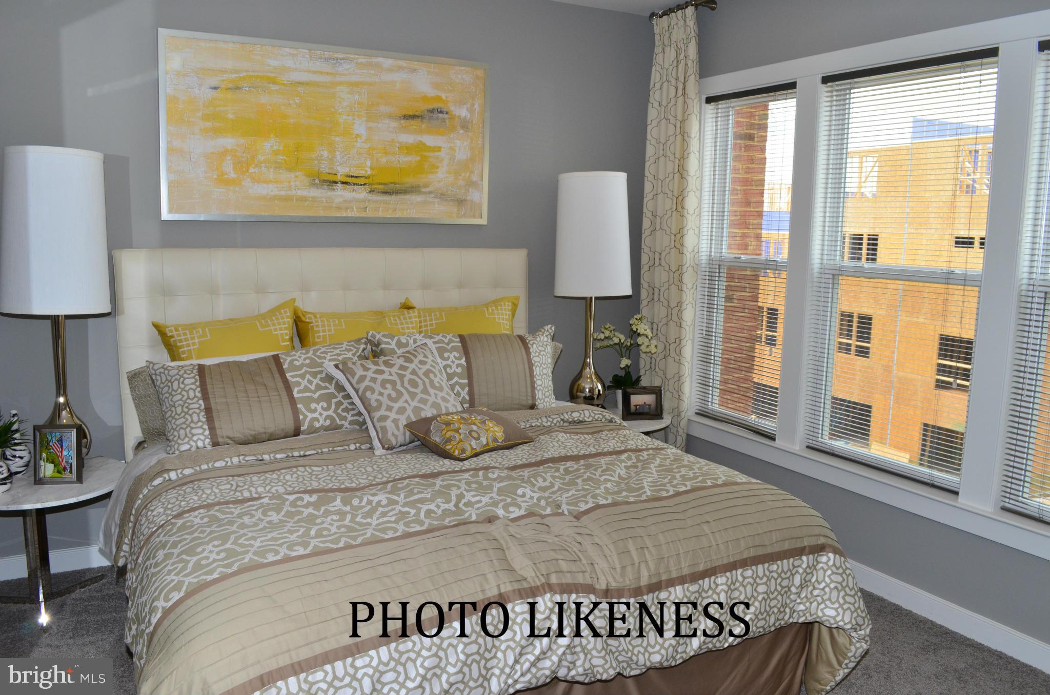 127 Decoverly Drive Gaithersburg, MD 20878 - Photo 18 of 30 a large bed sitting in a bedroom next to a window