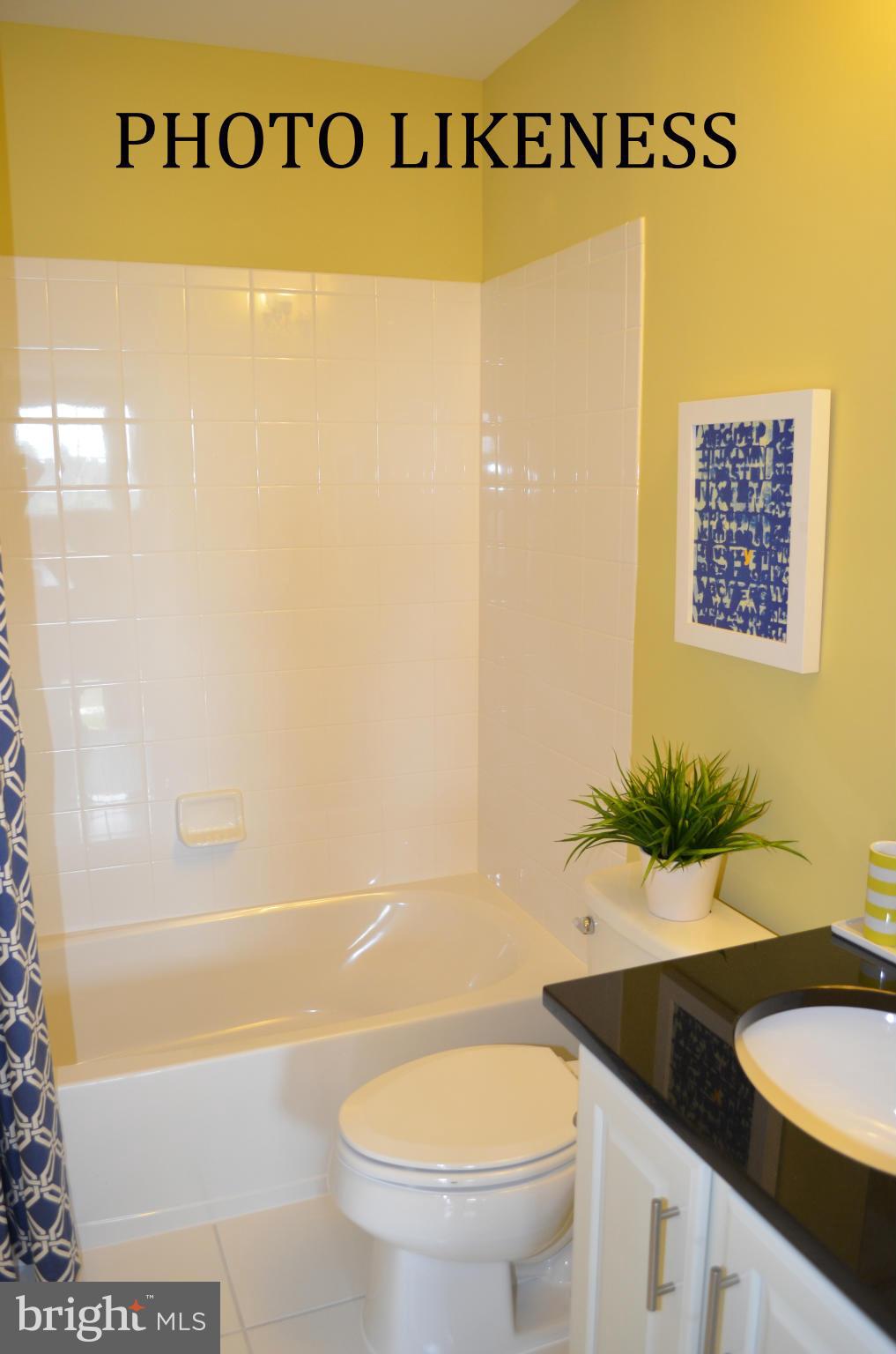 127 Decoverly Drive Gaithersburg, MD 20878 - Photo 26 of 30 a bathroom with a granite countertop sink and a mirror