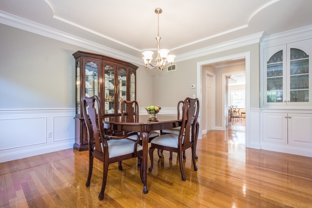 208 Fox Run Road Bolton, MA 01740 - Photo 8 of 30 a view of a dining room with furniture and chandelier