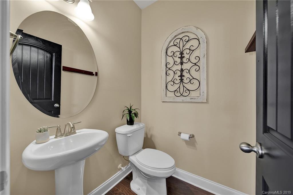 548 Rosemary Lane Tega Cay, SC 29708 - Photo 22 of 33 a bathroom with a toilet sink and mirror