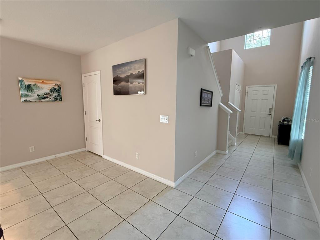 2084 Water Tupelo Way Ocoee, FL 34761 - Photo 2 of 34 a view of a hallway with closet area
