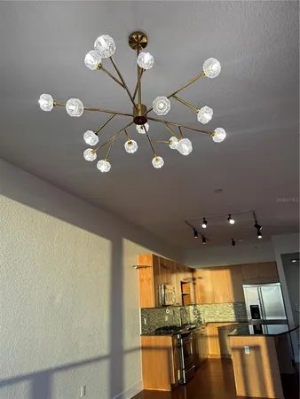 a view of a living room with furniture and a floor to ceiling window