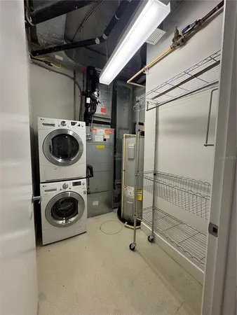 a view of a storage & utility room with a washer dryer