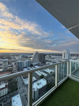 a view of a city with lawn chairs