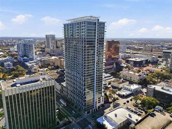 a view of roof deck with a barbeque and wooden stairs