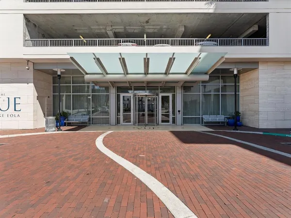 a view of swimming pool with outdoor seating and plants
