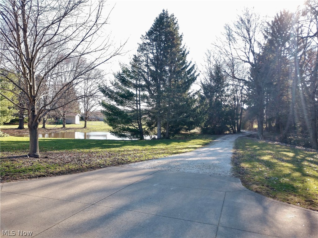 915 Sandy Lake Road Kent, OH 44240 - Photo 5 of 35 View of the private drive that crosses the creek that feeds the pond